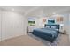Basement bedroom featuring a blue bed, closet and neutral decor at 2767 W 38Th Ave, Denver, CO 80211