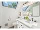 Bright bathroom with skylight, dual vanity, modern fixtures and large mirror at 2767 W 38Th Ave, Denver, CO 80211