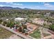 An aerial view highlights property boundaries, including the horse arena, outbuildings, and the house at 16225 W 74Th Dr, Arvada, CO 80007