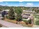 Charming home featuring beautiful landscaping, mature trees, horse property, and mountain views at 16225 W 74Th Dr, Arvada, CO 80007