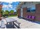 Exterior featuring a patio, lighting, and landscaping, perfect for outdoor entertaining at 16225 W 74Th Dr, Arvada, CO 80007