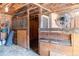 Inside the barn, it features wood paneled walls, wire mesh, a fan for ventilation, and a sturdy structure at 16225 W 74Th Dr, Arvada, CO 80007