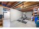 Unfinished basement with exposed beams and concrete floors at 16225 W 74Th Dr, Arvada, CO 80007