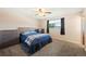 Cozy bedroom with neutral carpet, a comfy bed, and a window providing natural light at 16225 W 74Th Dr, Arvada, CO 80007