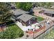Aerial view of house with brick and siding, backyard patio, pergola, and landscaping at 16225 W 74Th Dr, Arvada, CO 80007