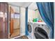 Laundry room with modern washer and dryer, plus an additional space at 16225 W 74Th Dr, Arvada, CO 80007