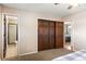 Main bedroom with closet and an ensuite bathroom at 16225 W 74Th Dr, Arvada, CO 80007