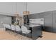 Modern kitchen featuring a large island with seating and sleek black cabinets at 5160 S Franklin St, Greenwood Village, CO 80121