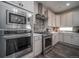 Modern kitchen with stainless steel appliances and an island at 21937 E 51St Dr, Aurora, CO 80019