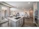 Open kitchen features island, breakfast bar, and access to the backyard at 21937 E 51St Dr, Aurora, CO 80019