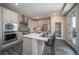Bright kitchen with island seating and lots of cabinet space at 21937 E 51St Dr, Aurora, CO 80019