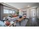 Spacious living area featuring a comfortable sofa and plenty of natural light at 21937 E 51St Dr, Aurora, CO 80019