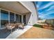 Covered patio with seating area and small landscaped backyard at 21937 E 51St Dr, Aurora, CO 80019
