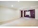 Large basement with neutral carpeting, and an accent wall at 247 Regal St, Louisville, CO 80027