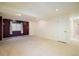 Spacious basement area with neutral carpeting, and purple accent wall at 247 Regal St, Louisville, CO 80027
