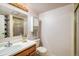 Bathroom features a vanity with a sink and a shower with sliding glass doors at 247 Regal St, Louisville, CO 80027