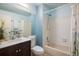 Cozy bathroom features a vanity with a marble top and a bathtub with shower at 247 Regal St, Louisville, CO 80027