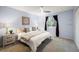 Bright bedroom featuring neutral decor, a ceiling fan, and a window with curtains at 247 Regal St, Louisville, CO 80027