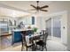 Inviting dining area adjacent to the kitchen, featuring a ceiling fan and sliding glass doors to the outside at 247 Regal St, Louisville, CO 80027