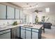 Bright kitchen featuring stainless appliances, dual sink, granite countertops, and stylish two-toned cabinetry at 247 Regal St, Louisville, CO 80027