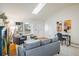 Comfortable living room featuring a skylight, modern furnishings, and access to the home's entrance at 247 Regal St, Louisville, CO 80027