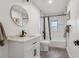 The renovated bathroom features new fixtures, updated tiling, and shower at 11842 W 14Th Ave, Lakewood, CO 80401