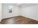 Bright, airy bedroom features wood floors and a window for natural light at 11842 W 14Th Ave, Lakewood, CO 80401