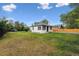 Charming single-story home with a well-maintained lawn and mature trees at 11842 W 14Th Ave, Lakewood, CO 80401