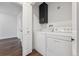 This laundry room features new appliances, including a washer and a dryer at 11842 W 14Th Ave, Lakewood, CO 80401