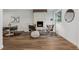 Bright living room features a modern fireplace and stylish seating arrangement at 11842 W 14Th Ave, Lakewood, CO 80401