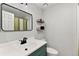 Bathroom featuring modern fixtures, vanity and an accent wall shelf with storage at 6836 E Briarwood Dr, Centennial, CO 80112