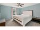 Serene bedroom with a neutral color palette, comfortable bed, and ample natural light from the window at 6836 E Briarwood Dr, Centennial, CO 80112