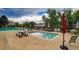 Community pool area with picnic tables, lounge chairs, and fenced in pool at 6836 E Briarwood Dr, Centennial, CO 80112