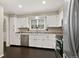 Bright kitchen with white cabinets, stainless steel appliances, and a functional layout for easy cooking at 6836 E Briarwood Dr, Centennial, CO 80112