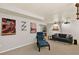 Cozy basement living room with a projector screen and modern decor, ideal for movie nights at 6836 E Briarwood Dr, Centennial, CO 80112
