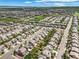 High-angle aerial view of a residential area featuring neatly aligned homes and manicured lawns at 10934 Touchstone Loop, Parker, CO 80134
