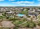 Stunning aerial view of community pool, playground and modern clubhouse on a sunny day at 10934 Touchstone Loop, Parker, CO 80134