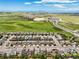 Scenic aerial view of homes in a planned community, highlighting nearby open land and highways at 10934 Touchstone Loop, Parker, CO 80134