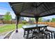 Backyard gazebo with comfortable seating, perfect for outdoor dining and entertaining at 10934 Touchstone Loop, Parker, CO 80134