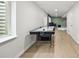 Finished basement with air hockey, laminate flooring, and neutral paint at 10934 Touchstone Loop, Parker, CO 80134