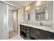 Bathroom with double vanity and granite countertops, featuring updated fixtures at 10934 Touchstone Loop, Parker, CO 80134