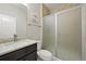 Bathroom featuring granite countertop vanity and glass-enclosed shower at 10934 Touchstone Loop, Parker, CO 80134