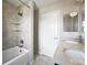 Full bathroom with combined bath and shower, featuring modern tile and fixtures at 10934 Touchstone Loop, Parker, CO 80134