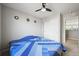 Cozy bedroom with carpeted floor, ceiling fan, and closet at 10934 Touchstone Loop, Parker, CO 80134