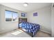 This bedroom offers lots of natural light from the large window at 10934 Touchstone Loop, Parker, CO 80134