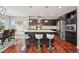 Modern kitchen island featuring stainless steel appliances, granite countertops, and sleek barstool seating at 10934 Touchstone Loop, Parker, CO 80134