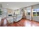 Bright and airy living room featuring hardwood floors, modern decor, and large windows for natural light at 10934 Touchstone Loop, Parker, CO 80134