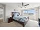 Spacious main bedroom featuring a ceiling fan and bright windows at 10934 Touchstone Loop, Parker, CO 80134