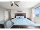 Comfortable main bedroom with a large bed and soft, natural lighting at 10934 Touchstone Loop, Parker, CO 80134