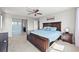 Main bedroom featuring a sliding glass door to the bathroom and a ceiling fan at 10934 Touchstone Loop, Parker, CO 80134